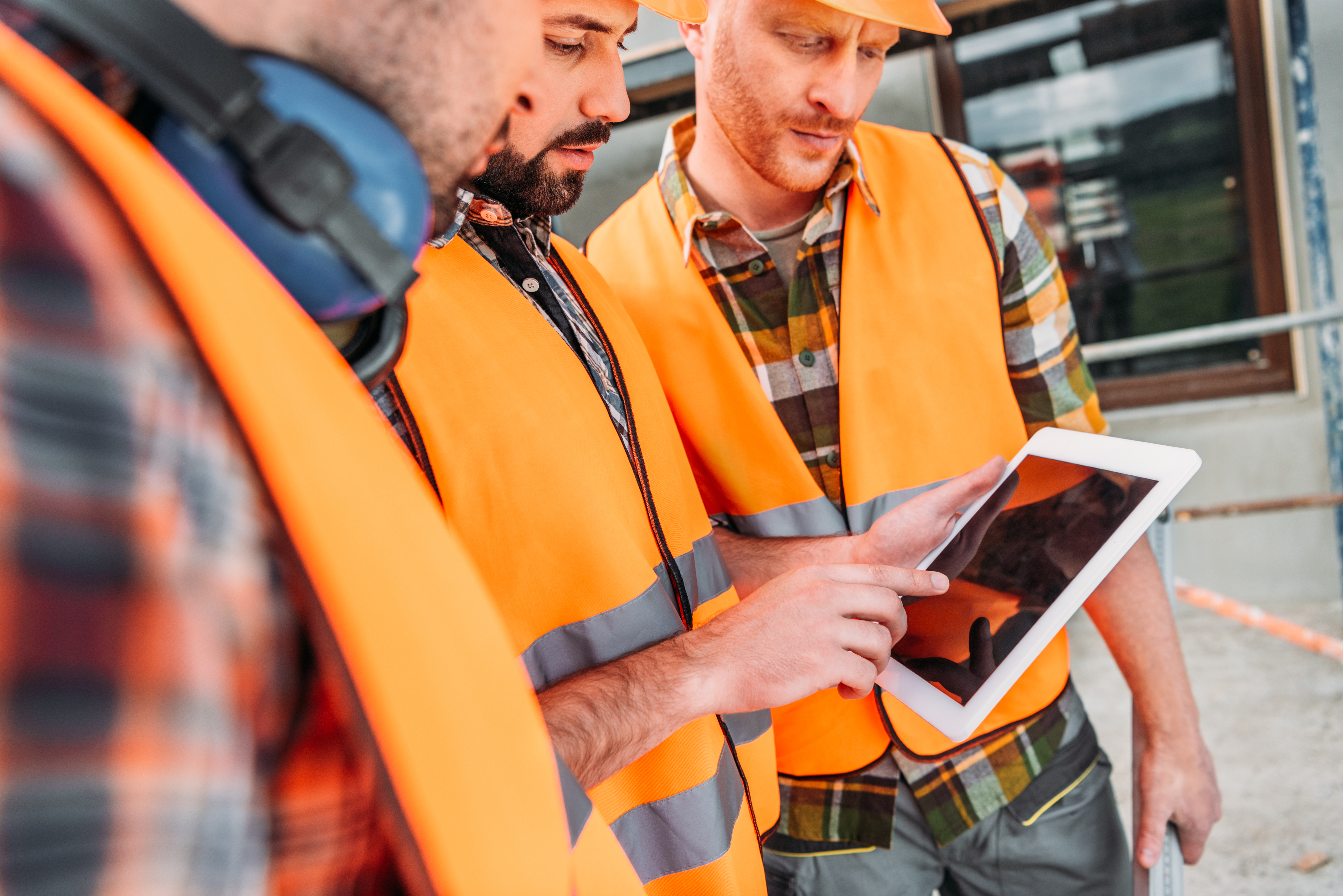 Construction workers reviewing site induction